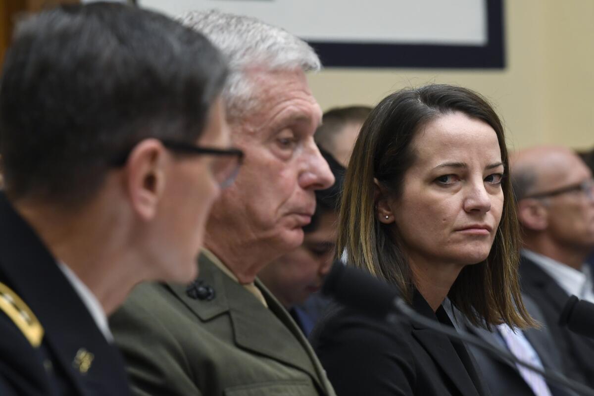 Acting Assistant Secretary of Defense for International Security Affairs Kathryn Wheelbarger, right, and U.S. Africa Command Commander Gen. Thomas Waldhauser, center, listen as U.S. Central Command Commander Gen. Joseph Votel, left, testifies before the House Armed Services Committee on in Washington in March.