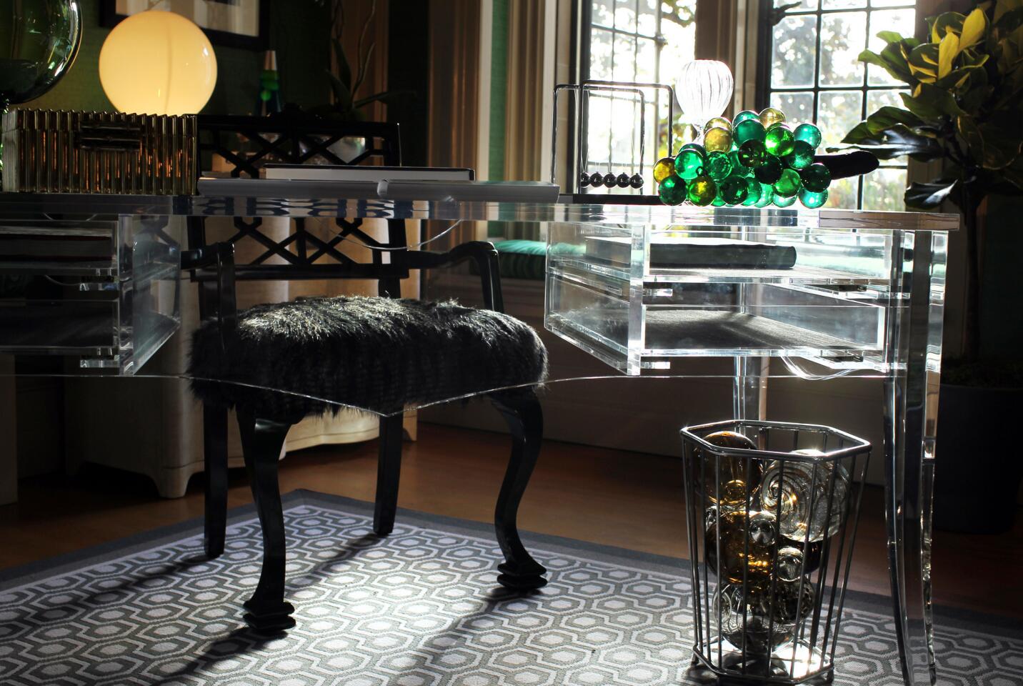 Michael Ostrow of Grace Home Furnishings added a Lucite desk to the emerald green bedroom he designed with fashion designer Halston in mind.