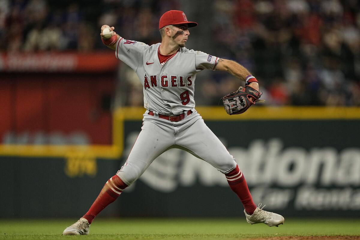 Angels shortstop Zach Neto throws to first base.