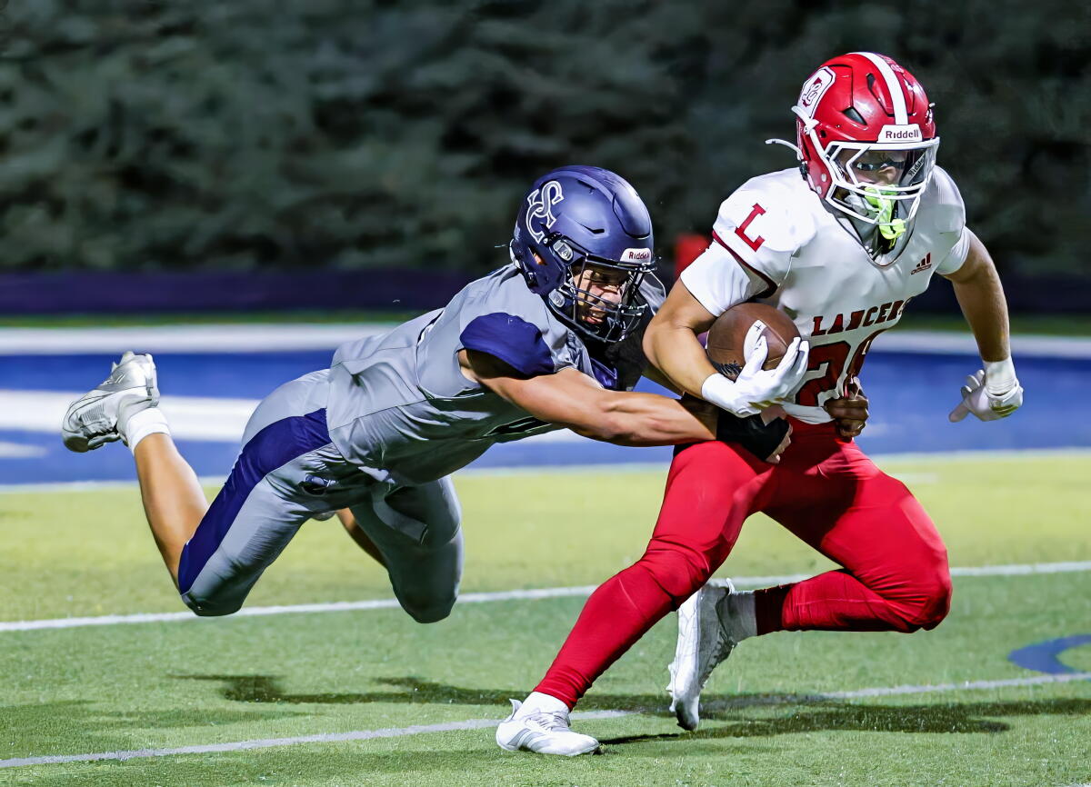 Sophomore linebacker Eli Zamorano of Sierra Canyon gets tackle against Orange Lutheran.