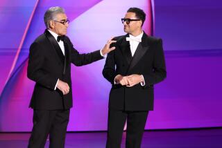 LOS ANGELES, CA - September 15, 2024 - Eugene Levy and Dan Levy during the 76th Primetime Emmy Awards at the Peacock Theater on Sunday, September 15, 2024 (Robert Gauthier / Los Angeles Times)