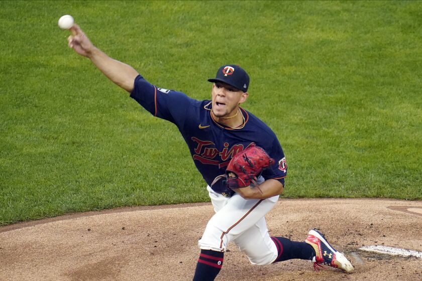 Minnesota Twins pitcher Jose Berrios throws against the Chicago White Sox in the first inning of a baseball game Tuesday, July 6, 2021, in Minneapolis. (AP Photo/Jim Mone)