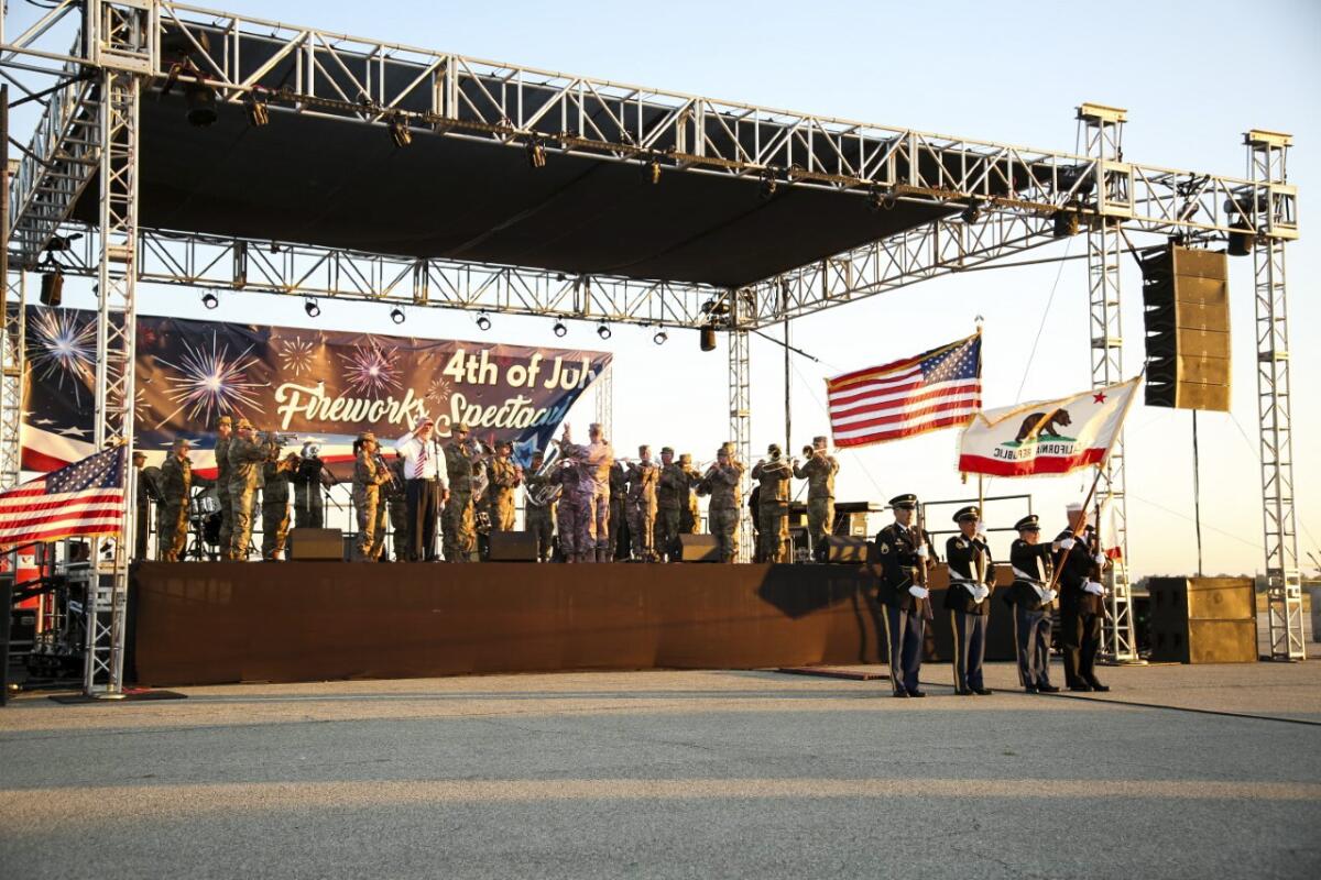 Army band plays on a stage