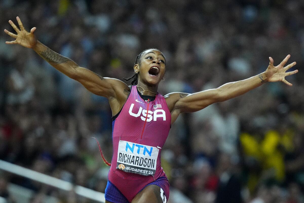 Sha'Carri Richardson celebrates after winning the women's 100-meter title at the world championships in Budapest, Hungary.