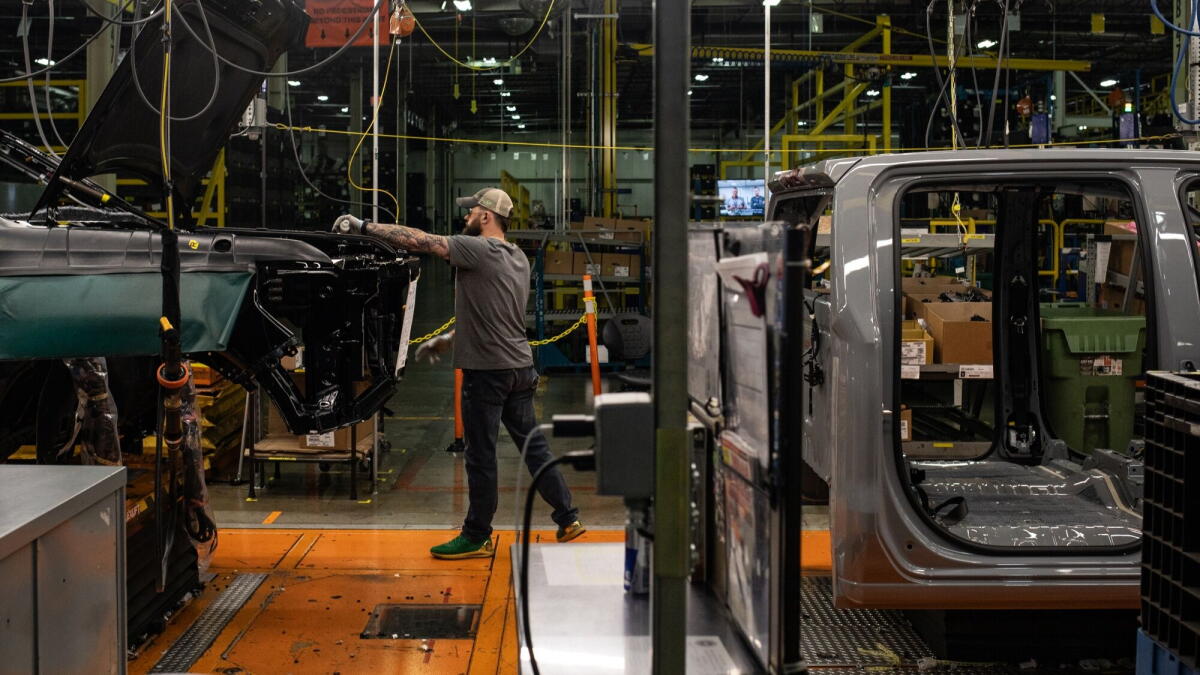 Vehicles on the trim assembly line at the General Motors assembly plant in Fort Wayne, Ind.
