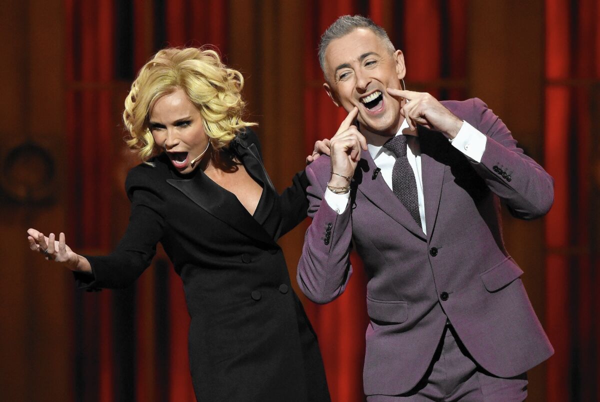 Best musical "Fun Home" and best play "The Curious Incident of the Dog in the Night-Time" mark a night of surprises at the Tonys. Above, the show's hosts, Kristin Chenoweth and Alan Cumming.