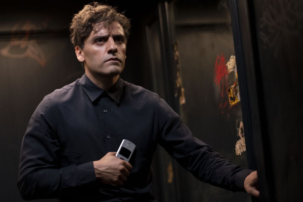 a man holding a flip phone