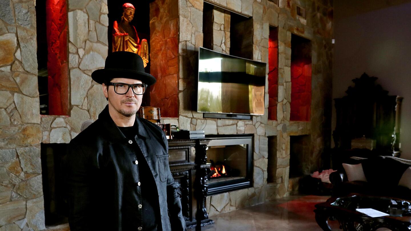 “It puts my soul at ease and calibrates me but at the same time looks like a vampire lair,” the host of "Ghost Adventures" says of his living room.