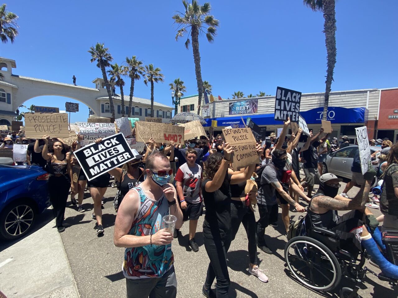 Demonstrators march in the Pacific Beach Walk for Equality in support of Black Lives Matter.