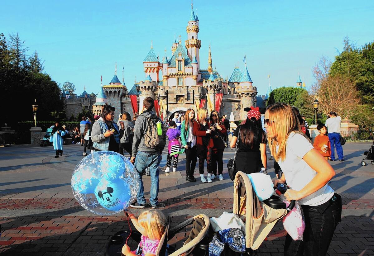 Disneyland guests enjoy a day at the park. A person ill with measles who was at the park triggered an outbreak that has infected 26 people in four states.