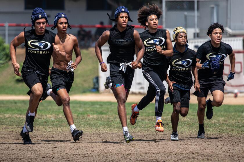 EAST LOS ANGELES, CA - JULY 22: Garfield High School football team at Summer passing competition.