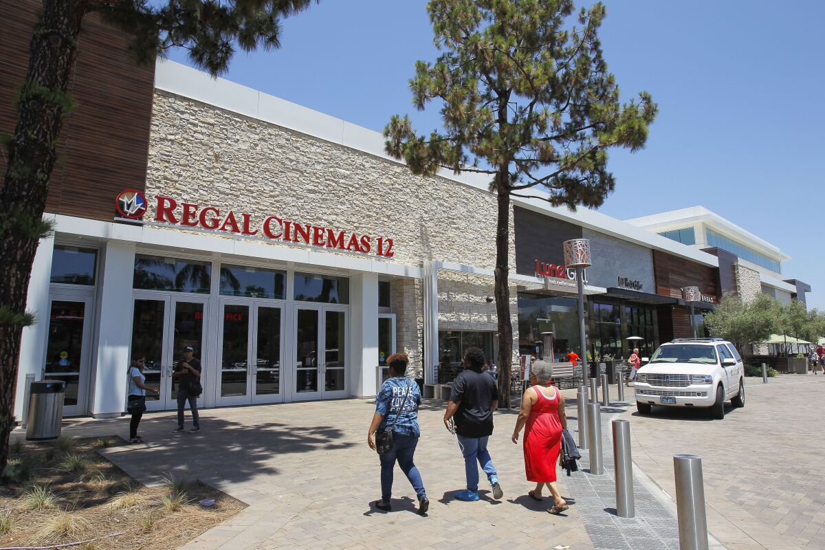 People enter The Shoppes at Carlsbad mall in Carlsbad in 2017.