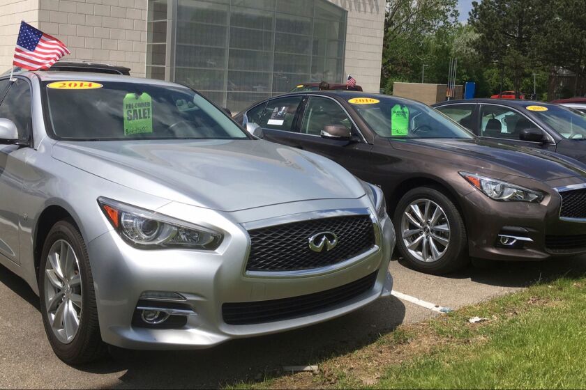 In this Wednesday, May 17, 2017, photo, used Infiniti Q50 luxury sedans await buyers at a dealership in the Detroit suburb of Novi, Mich. Leases are ending on a large number of Q50s and other cars, flooding the market with quality used cars. (AP Photo/Tom Krisher)