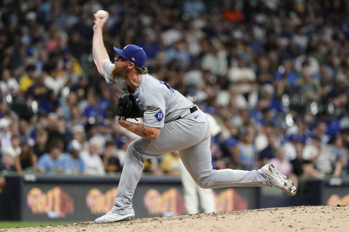 The Dodgers' Michael Kopech pitches during the eighth inning of Monday's game against the Brewers in Milwaukee.