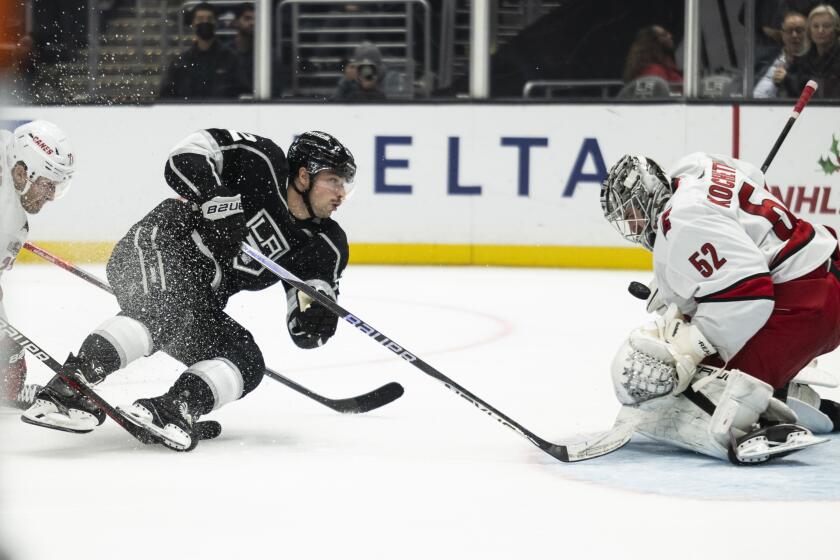 Carolina Hurricanes goaltender Pyotr Kochetkov (52) blocks the shot by Los Angeles Kings.