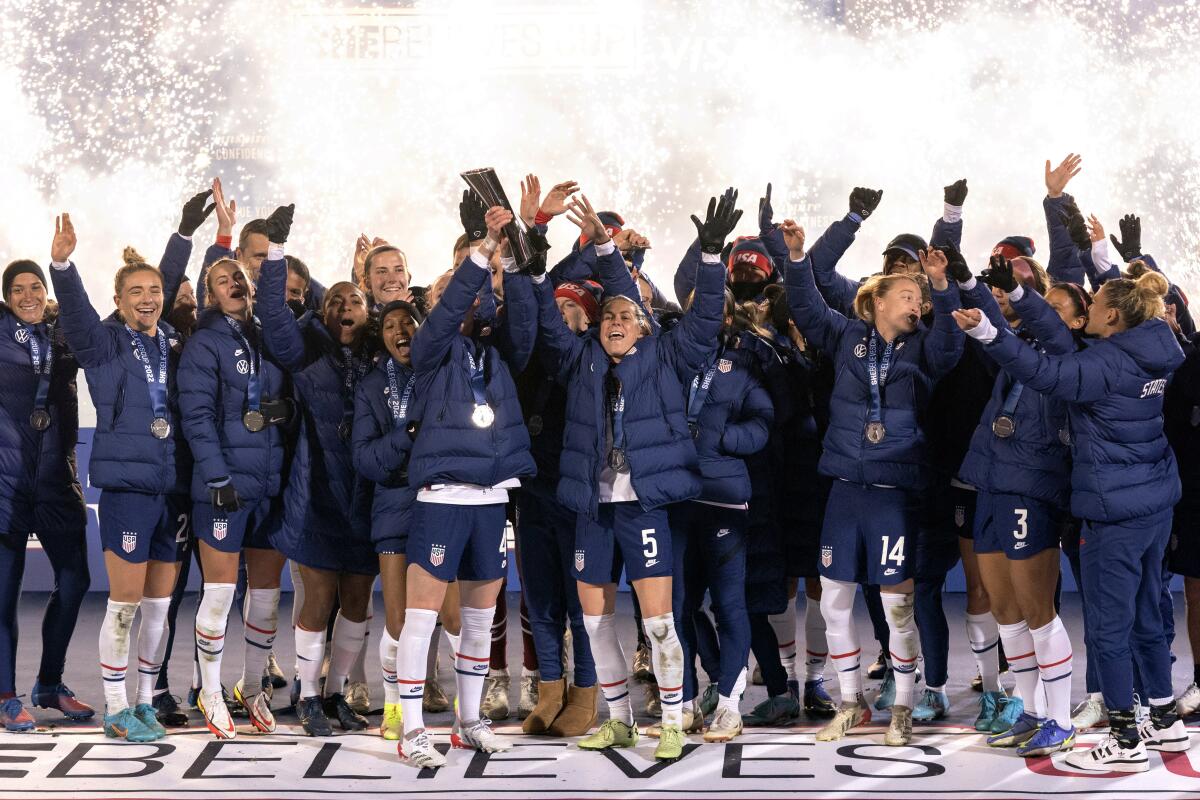 The U.S. women's national team hoists the SheBelieves Cup trophy after a 5-0 win over Iceland.