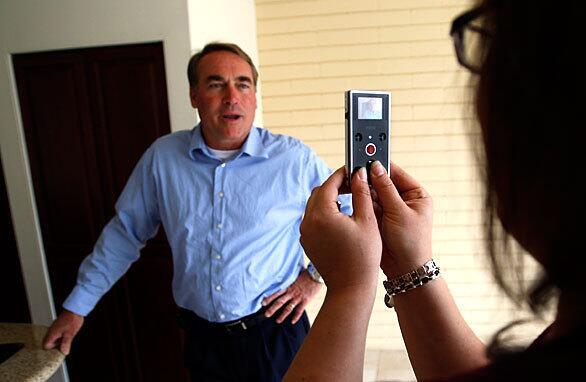 Los Angeles Times reporter Kimi Yoshino videotapes property manager Jack Cerneka in the Long Beach apartment where she will live with her husband, Saif. She routinely sends him video of what his new city looks like so he can be better prepared for life in the US.