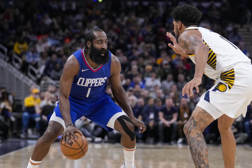 Clippers guard James Harden drives on Indiana Pacers forward Obi Toppin.