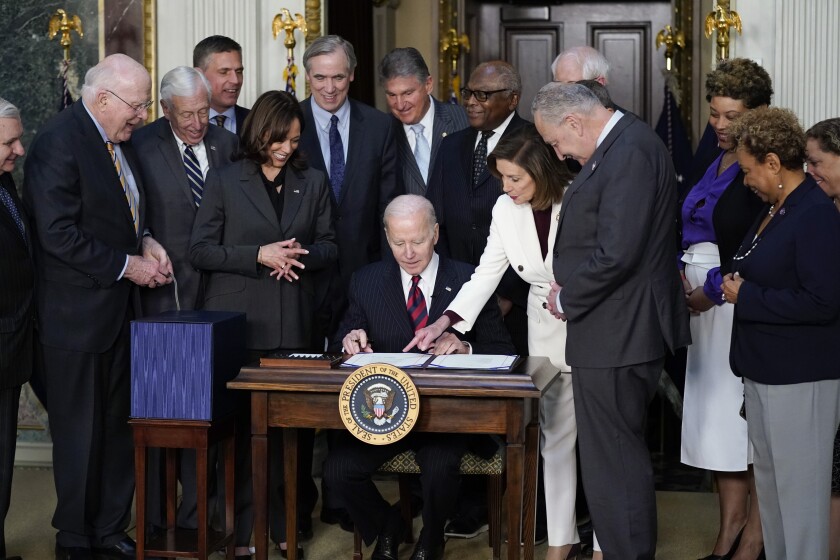   Vice President Kamala Harris was with President Biden when he signed the spending bill Tuesday.