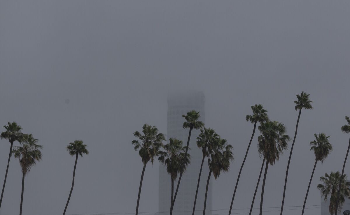 The U.S. Bank Tower, a 1,018-foot skyscraper, is seen under heavy clouds in Los Angeles on Thursday.