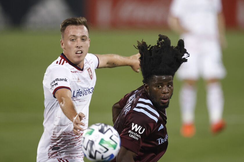 Real Salt Lake forward Corey Baird, left, pursues the ball with Colorado Rapids defender Lalas Abubakar in the second half of an MLS soccer match Saturday, Aug. 22, 2020, in Commerce City, Colo. (AP Photo/David Zalubowski)