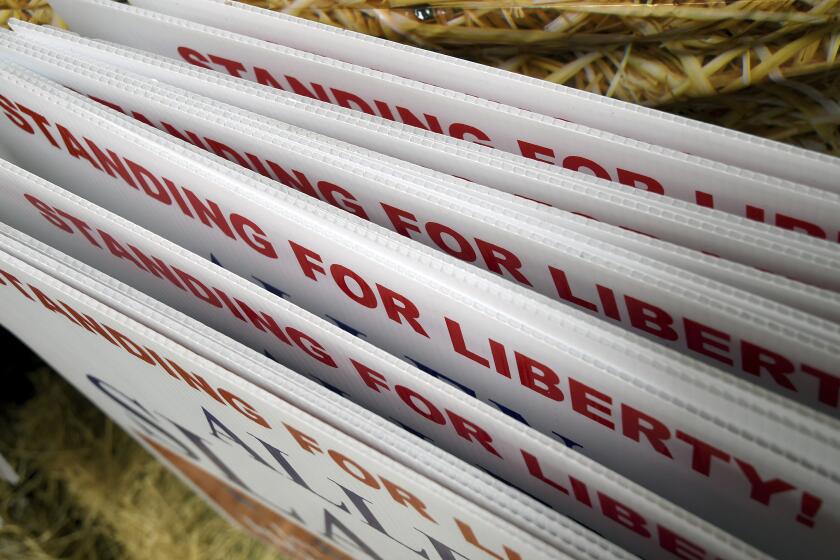 Republican political signs are displayed at the Niobrara County Fair in Lusk, Wyo., on July 31, 2024. (AP Photo/Thomas Peipert)