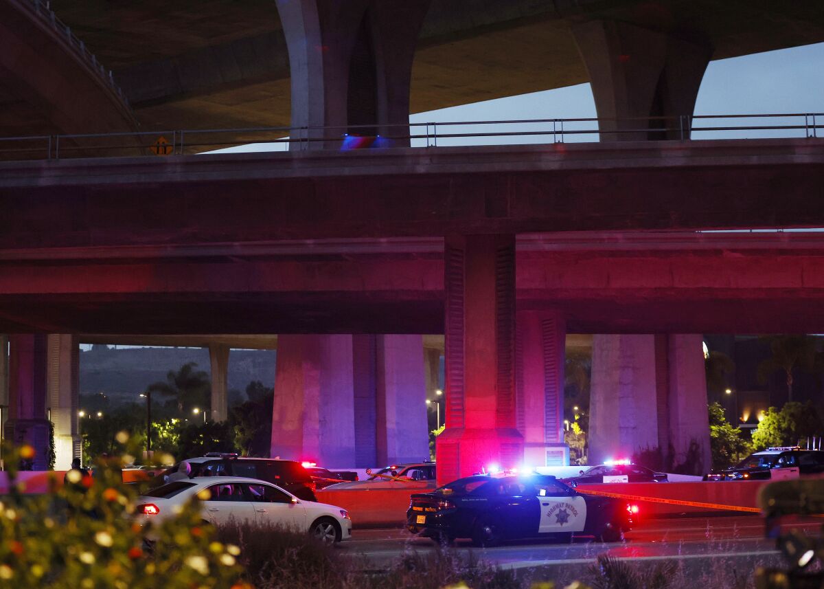 The California Highway Patrol investigates a scene on Interstate 8 in Mission Valley where a CHP officer was shot Wednesday.