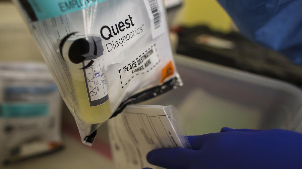 Employee donor samples are collected to test for street drugs at a Quest Diagnostics location in Upland in 2016.