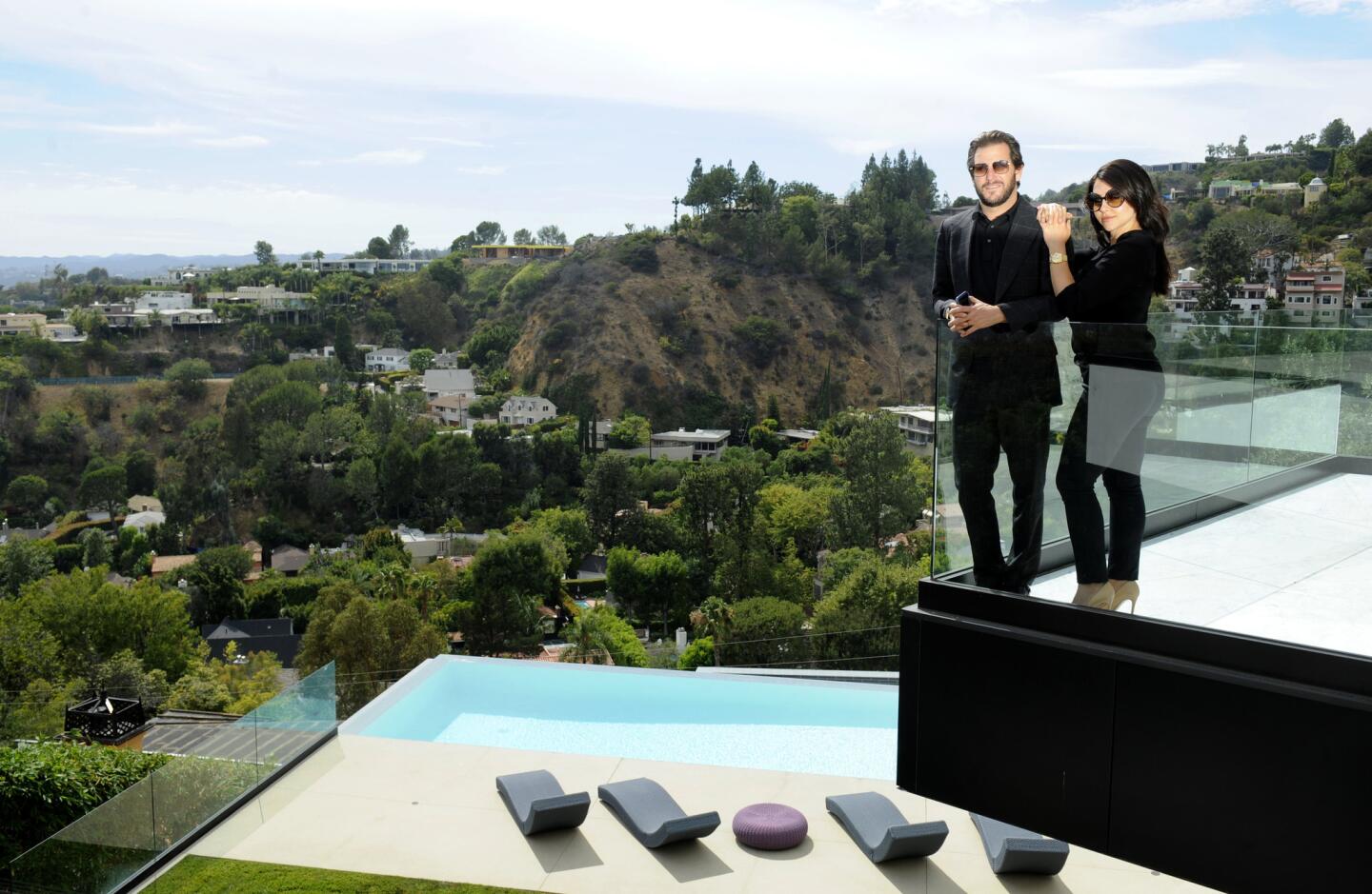 Real estate agents Branden and Rayni Williams at a $33-million mansion on Oriole Way in Los Angeles; they spent more than $40,000 on a "lifestyle film" to help market the property.