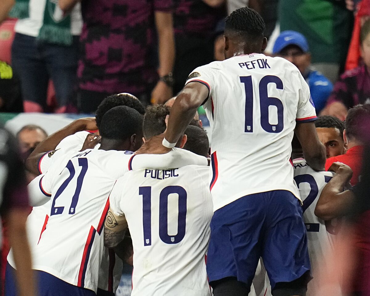 U.S. players celebrate a goal against Mexico during the second half of the CONCACAF Nations League championship.