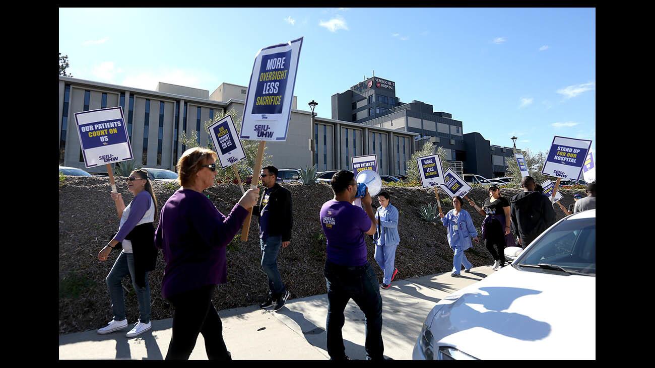 Members and staff of SEIU-UHW picket for contract resolution outside Verdugo Hills Hospital in Glendale on Wednesday, Dec. 19, 2018. About 40 people walked the picket line during their breaks, with a total of about 100 signing up to take turns on the sidewalk.