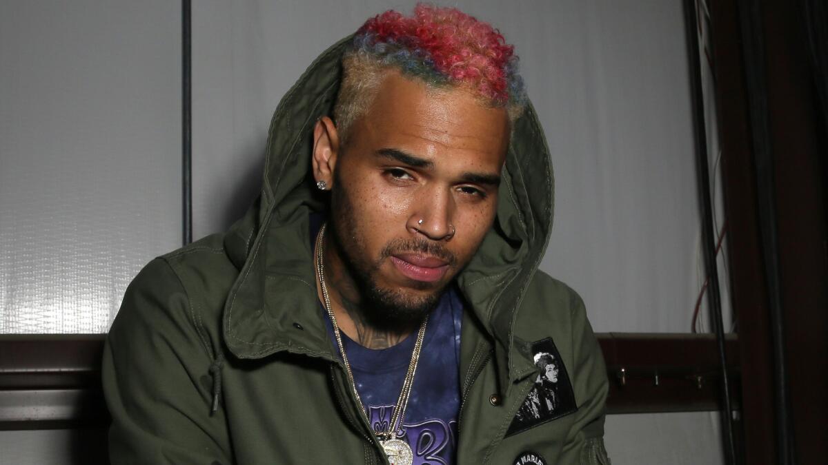 Singer Chris Brown came home to find a female intruder Wednesday night at his Agoura Hills home.