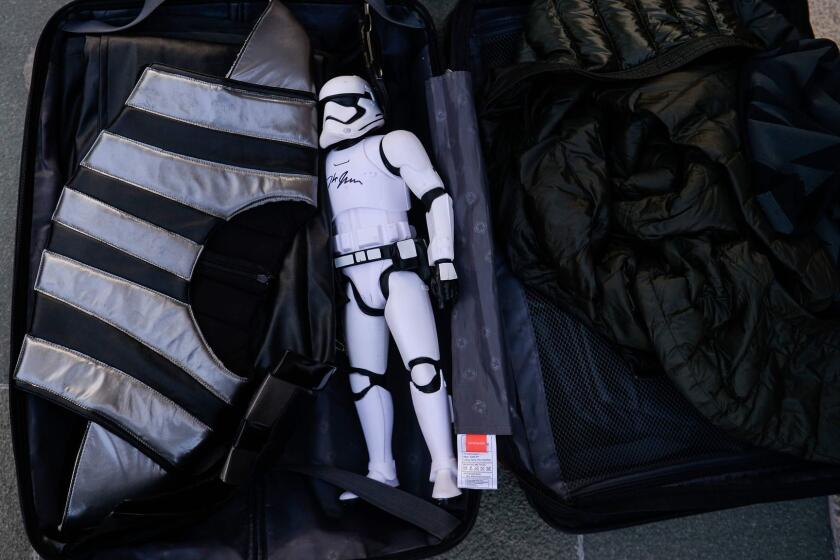 A stormtrooper action figure is seen packed along with other belongings of a fan at the red carpet for the Chinese premiere of 'Star Wars: The Last Jedi' at the Shanghai Disney Resort in Shanghai on December 20, 2017. / AFP PHOTO / CHANDAN KHANNACHANDAN KHANNA/AFP/Getty Images ** OUTS - ELSENT, FPG, CM - OUTS * NM, PH, VA if sourced by CT, LA or MoD **