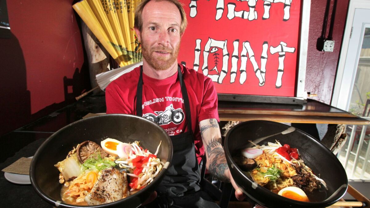 Chef Davin Waite, owner of The Whet Noodle, holds two of his ramen noodle creations.