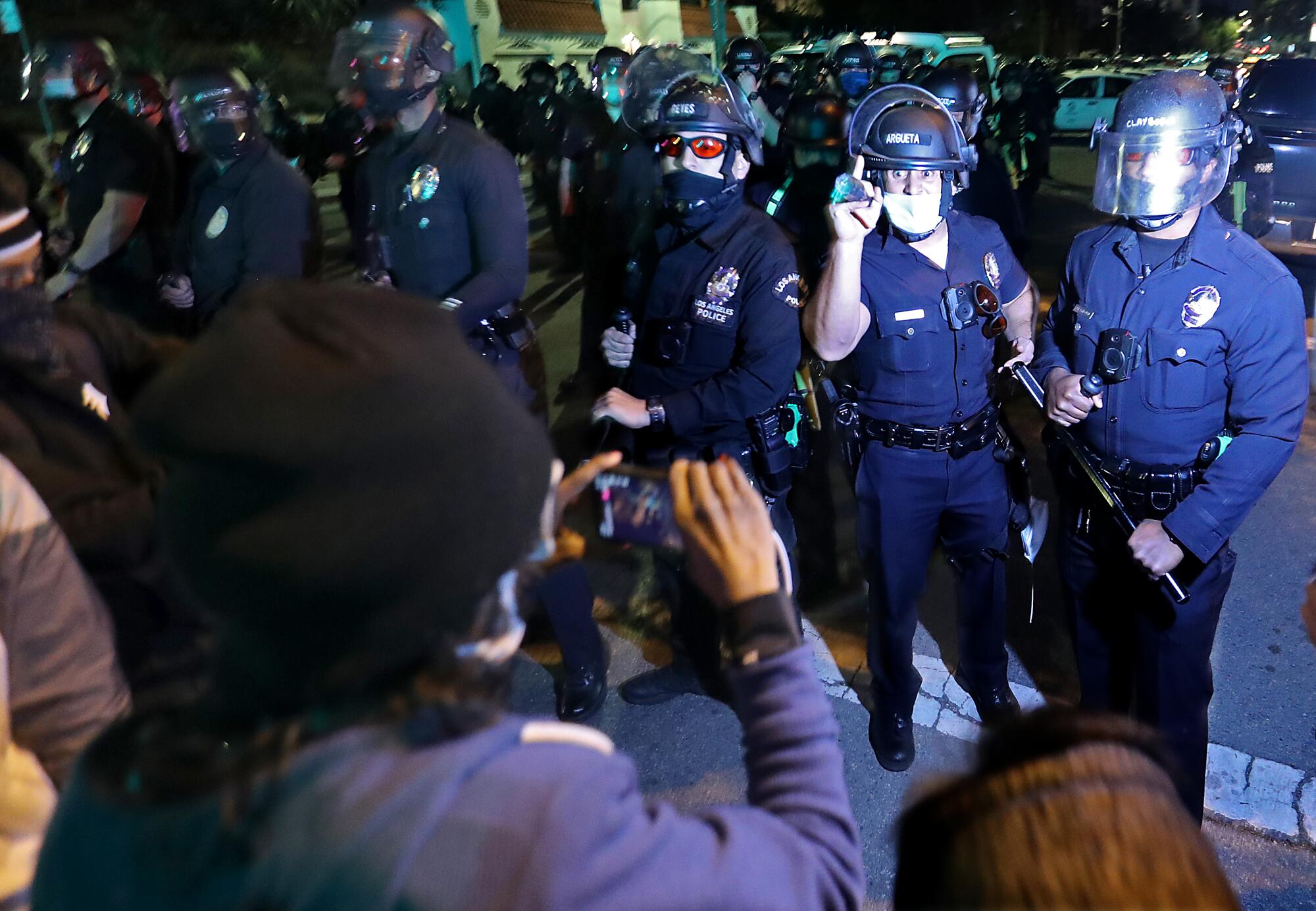 Protesters and police face off. 