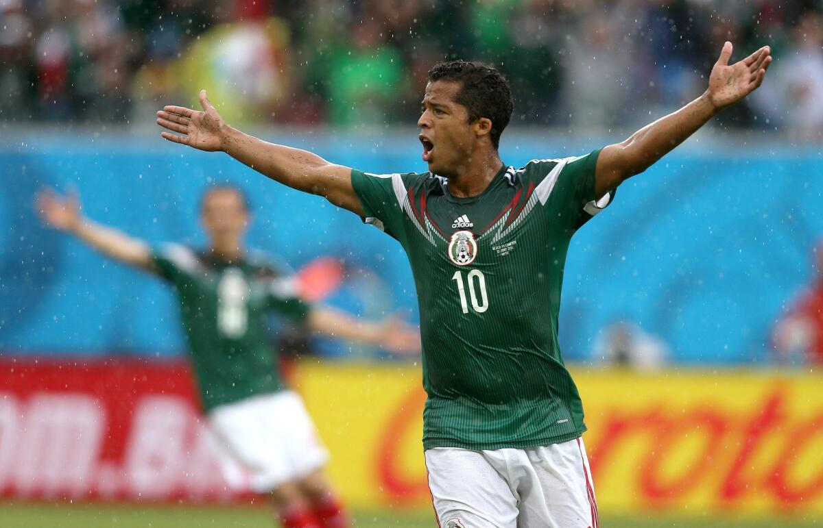 Giovani Dos Santos of Mexico reacts after his goal is disallowed.
