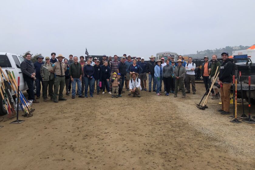 A group of volunteers began work on the Coast to Crest Trail at Surf Sports Park on Dec. 4.