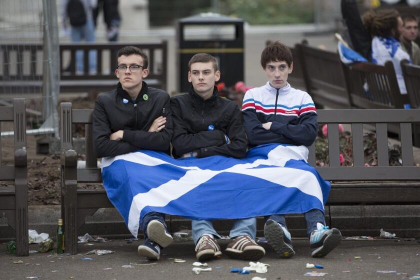 Independence supporters mull their defeat in George Square in Glasgow, Scotland.