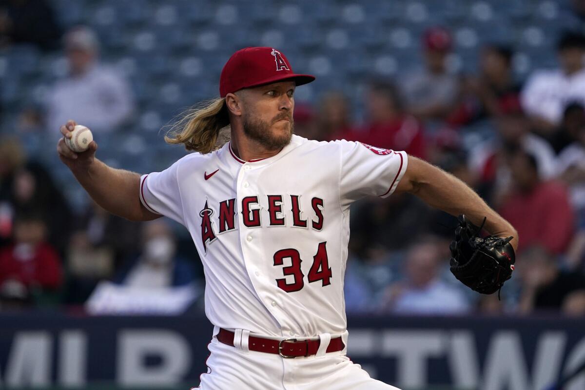 Angels pitcher Noah Syndergaard throws to the plate during the second inning against the Texas Rangers.