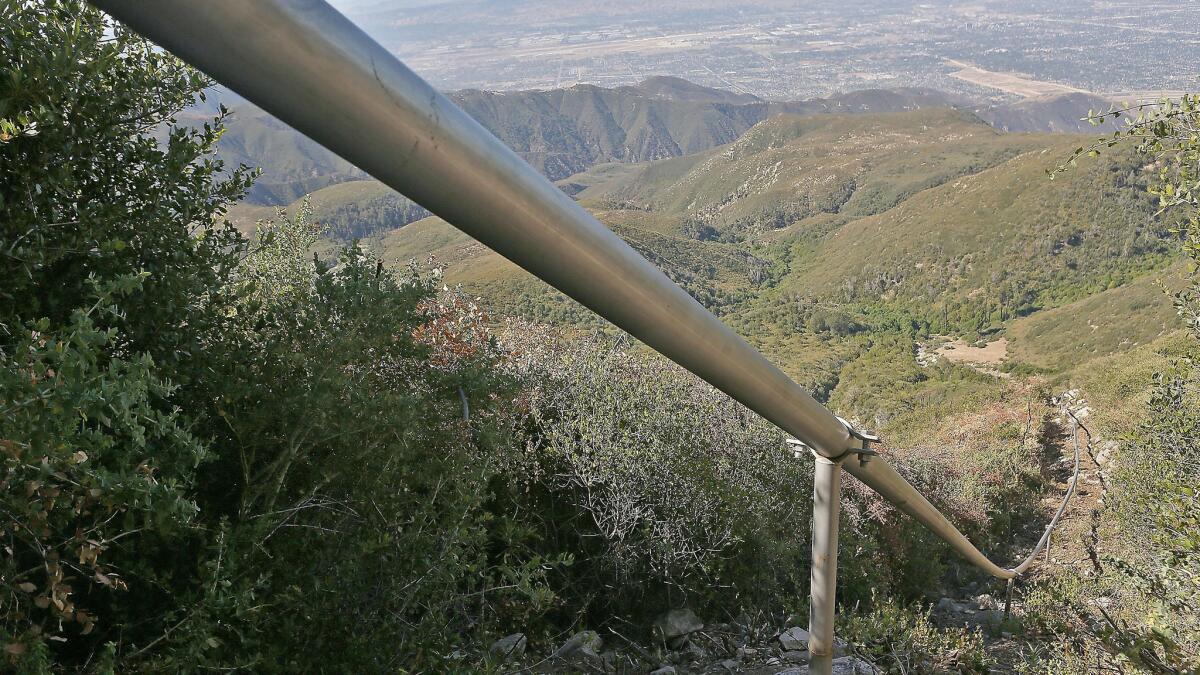In this July 13, 2015, photo, a pipeline carries water drawn from wells in the San Bernardino National Forest, Calif. The water is sold by Nestle Waters North America as Arrowhead brand bottled water.
