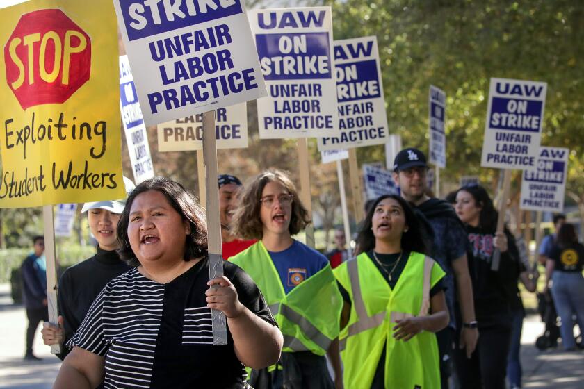 Irvine, CA - November 15: Unionized academic workers, student researchers and post-doctoral scholars demanding better pay and benefits rally at University of California Irvine on Tuesday, Nov. 15, 2022 in Irvine, CA. (Irfan Khan / Los Angeles Times)