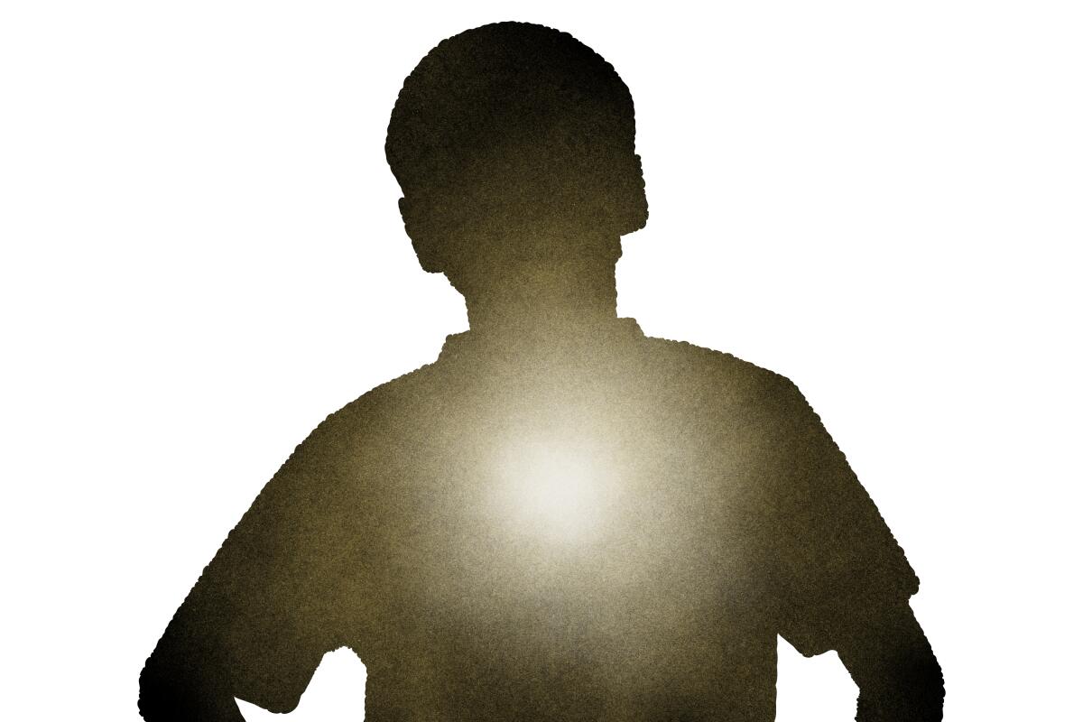 Silhouette of a young boy with a glowing light radiating from his center.