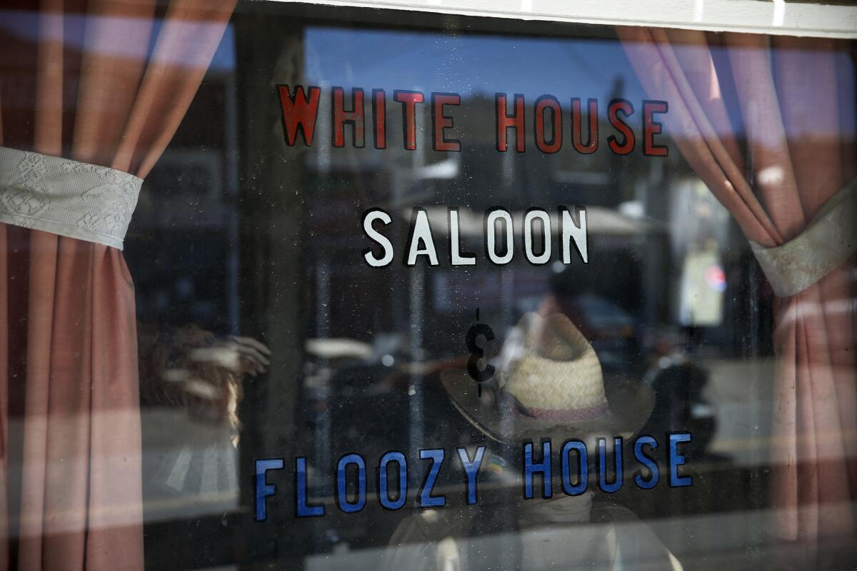 A view of the window display at the White House Saloon in downtown Randsburg. (Allen J. Schaben / Los Angeles Times)