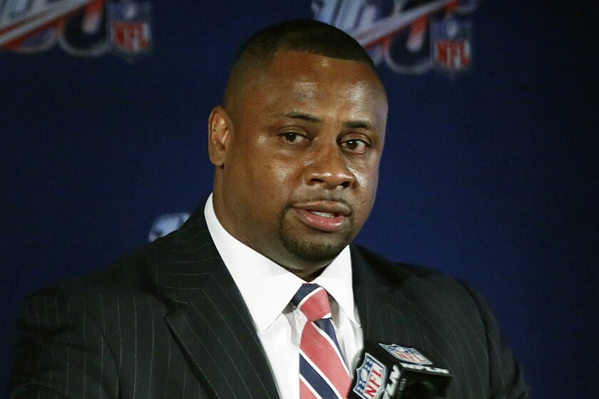 FILE - In this May 22, 2019, file photo, Troy Vincent, NFL executive vice president of football operations, speaks to the media during the owners meetings in Key Biscayne, Fla. Flag football will be played at an international, multi-sport event for the first time next week during the World Games in Birmingham, Alabama. The NFL may be the sport’s biggest cheerleader. “When we talk about the future of the game of football, it is, no question, flag,” NFL executive Troy Vincent told The Associated Press. (AP Photo/Brynn Anderson, File)