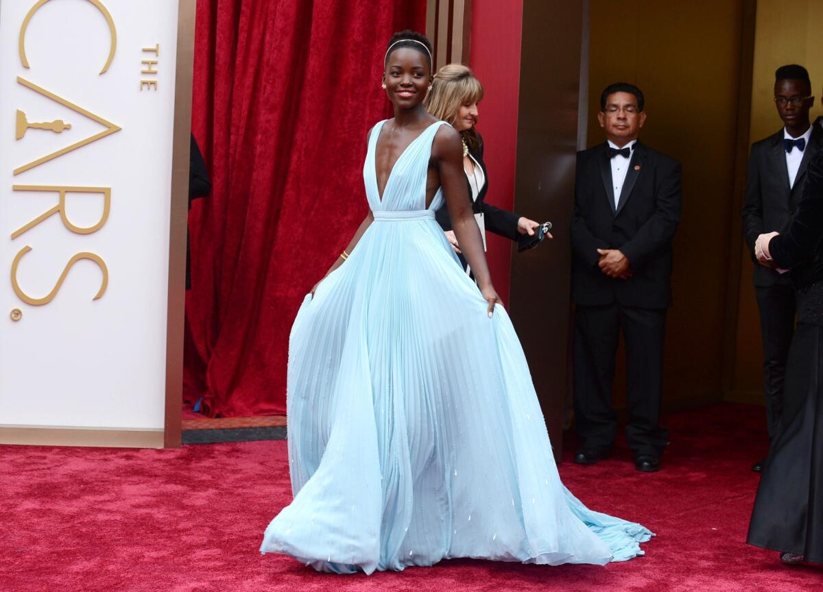 Lupita Nyong'o wears a Prada gown at the 86th Academy Awards.