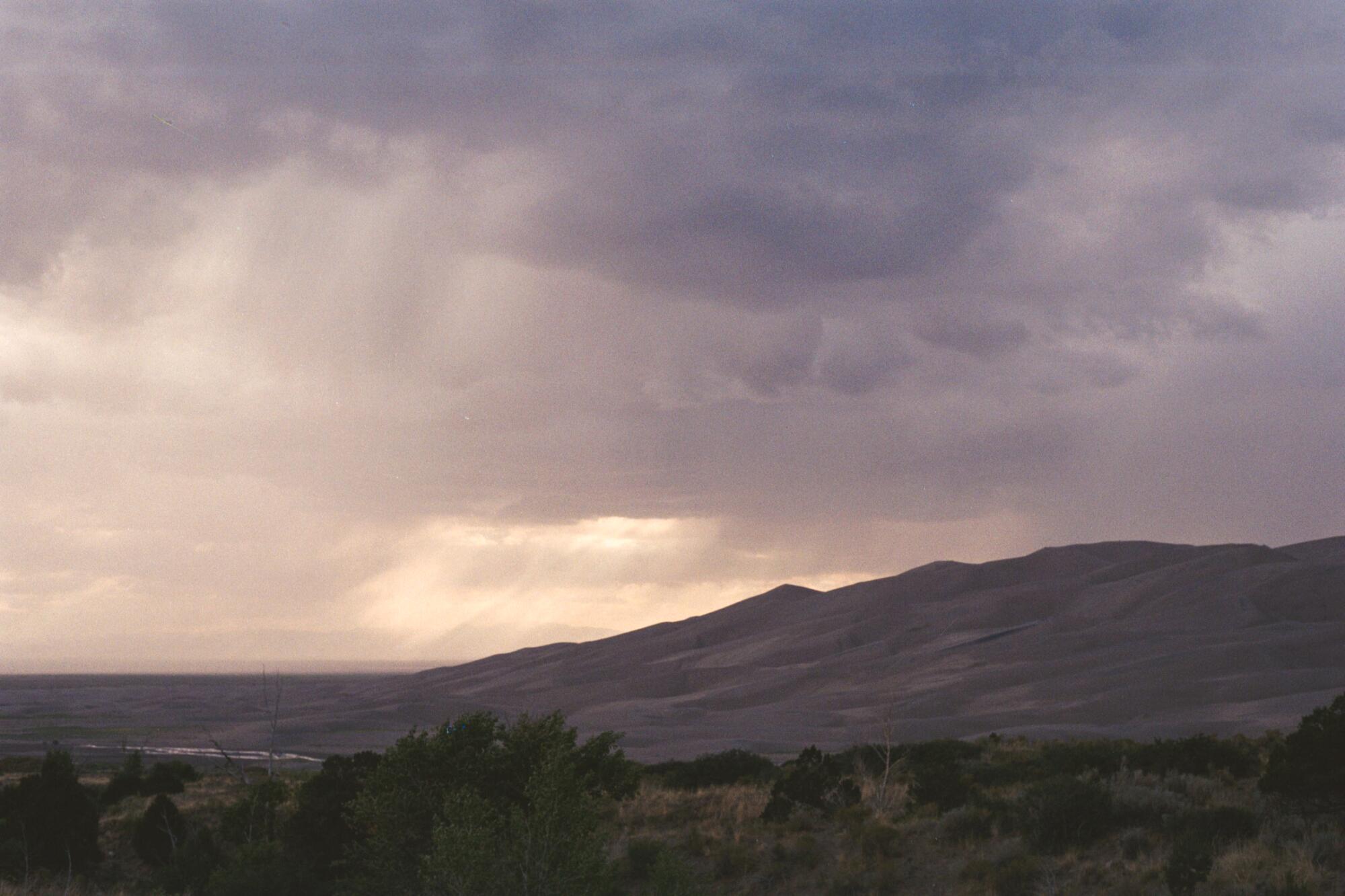 Rain over Great Sand Dunes National Park and Preserve.