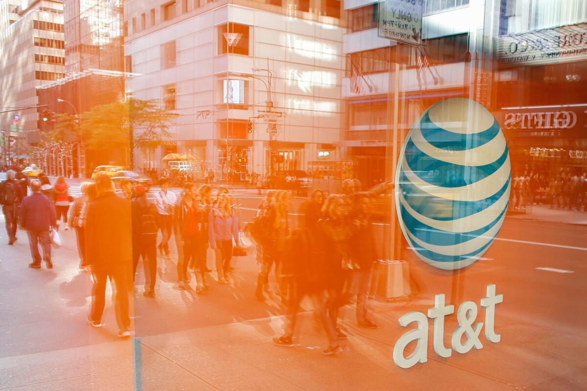 Opponents of AT&T’s deal to buy Time Warner said the collusion suit was another reason for regulators to reject the deal. Above, an AT&T store in New York City.