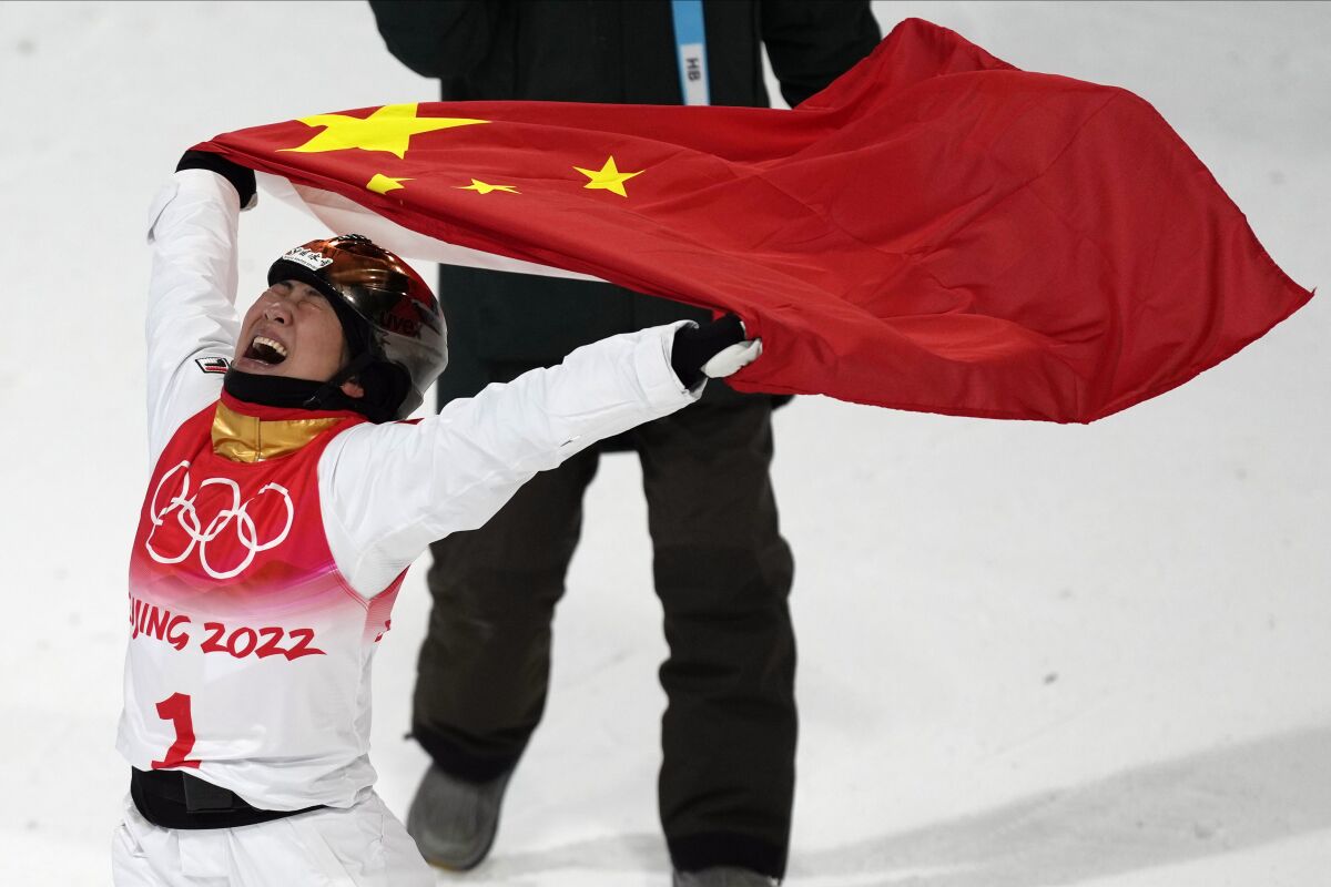China's Xu Mengtao celebrates after winning a gold medal in the women's aerials finals at the 2022 Winter Olympics, Monday, Feb. 14, 2022, in Zhangjiakou, China. (AP Photo/Lee Jin-man)