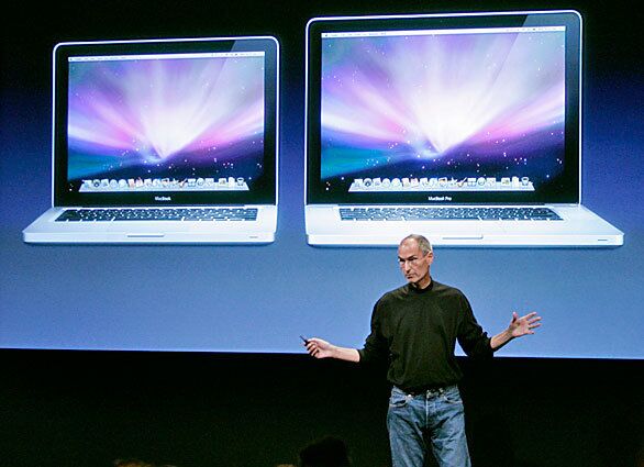 Jobs introduces new versions of the MacBook, left, and MacBook Pro at Apple headquarters in Cupertino, Calif.