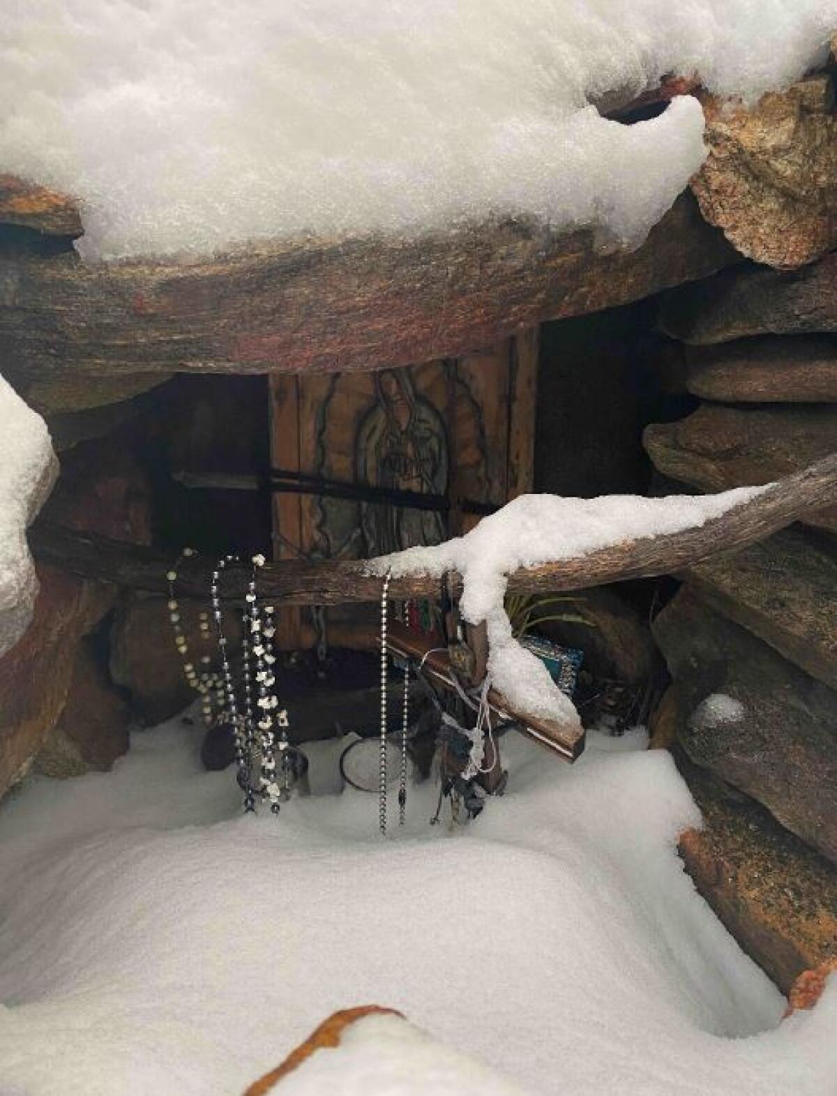A snow-covered shrine to the Virgen de Guadalupe in the mountains southeast of Mount Laguna.